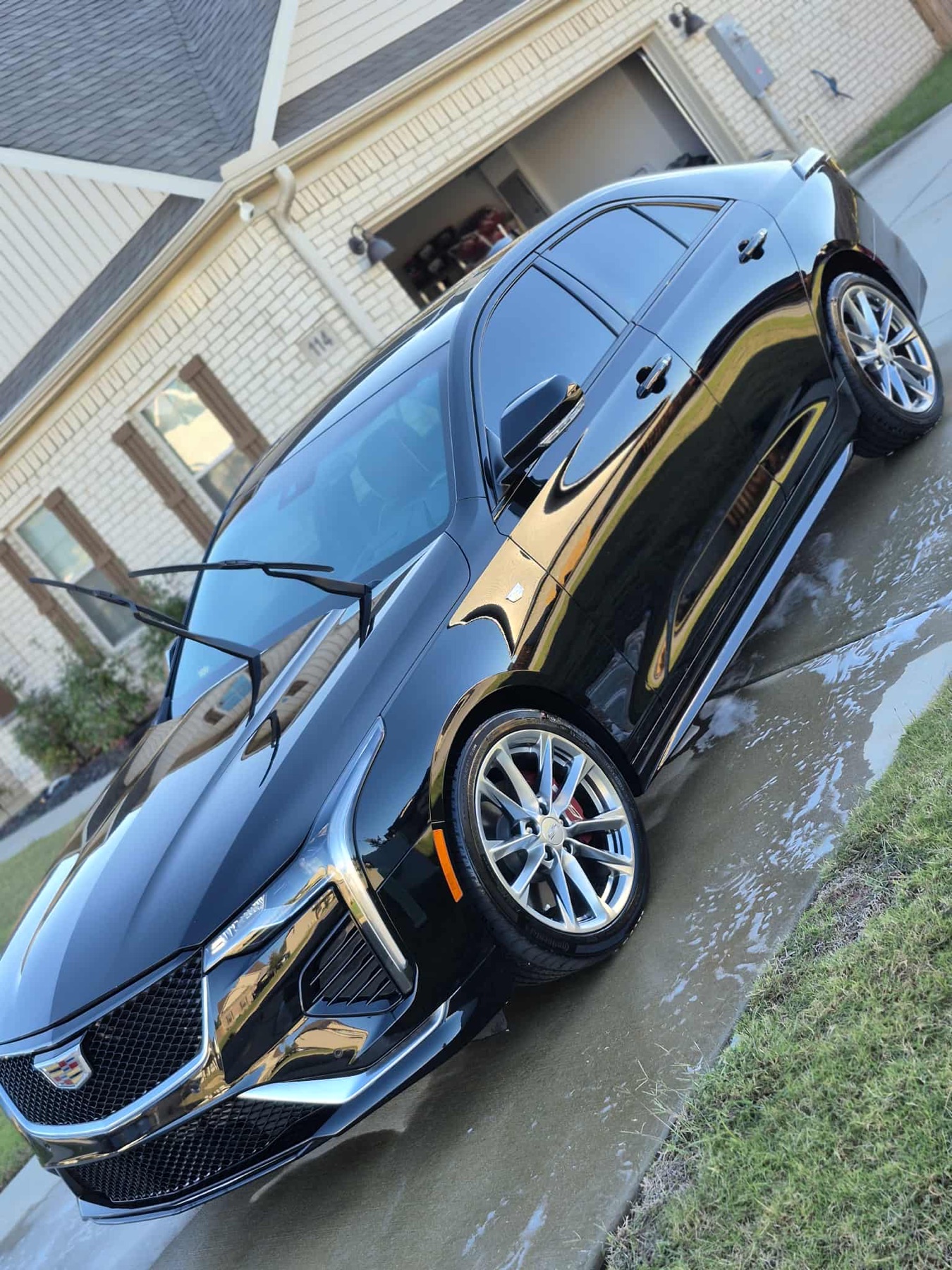 Black Cadillac sedan after a gloss exterior detail